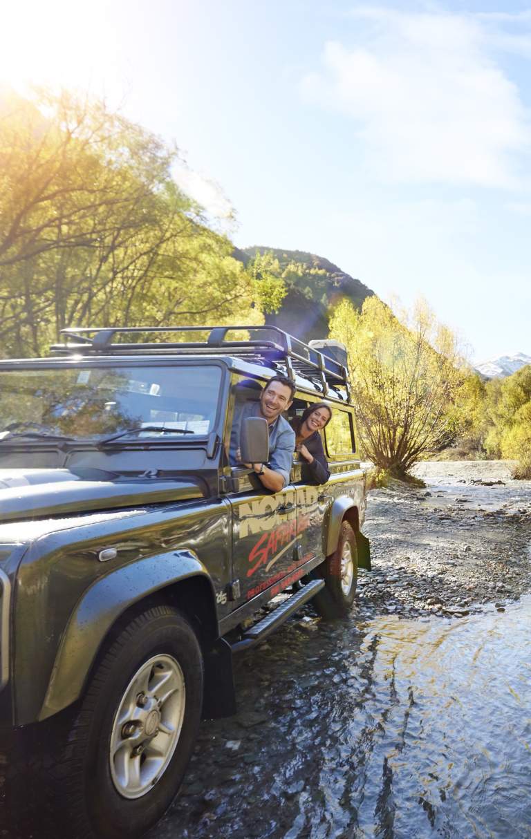 Nomad Safaris truck crossing river in Autumn