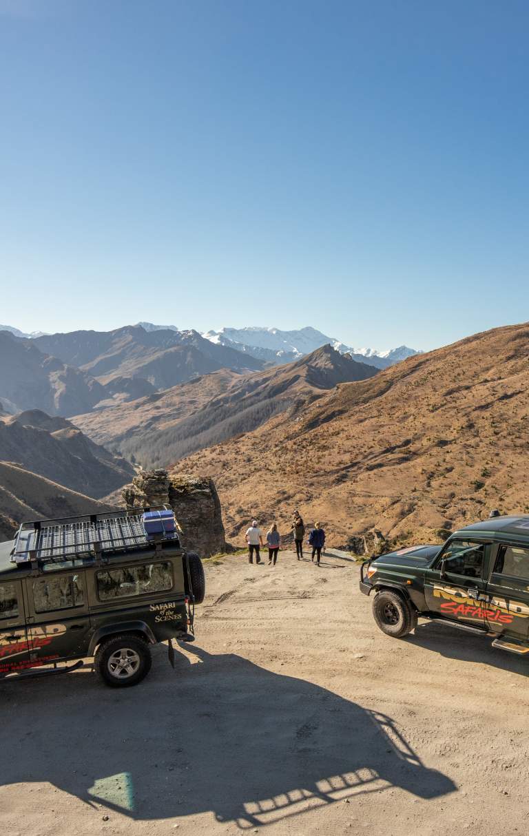 Group with two cars parked at Lighthouse Point on the Skippers Road Queenstown