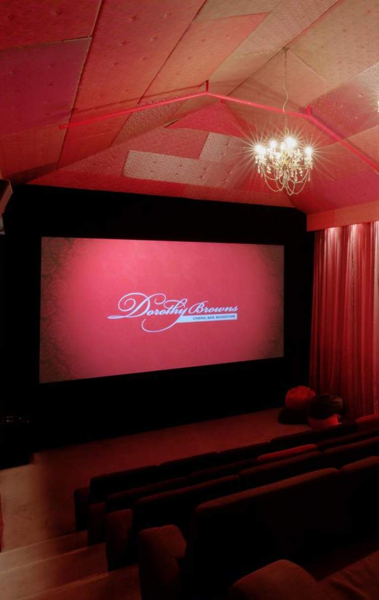 Inside Dorothy Browns Cinema with lush red interior and large comfortable seats, Arrowtown