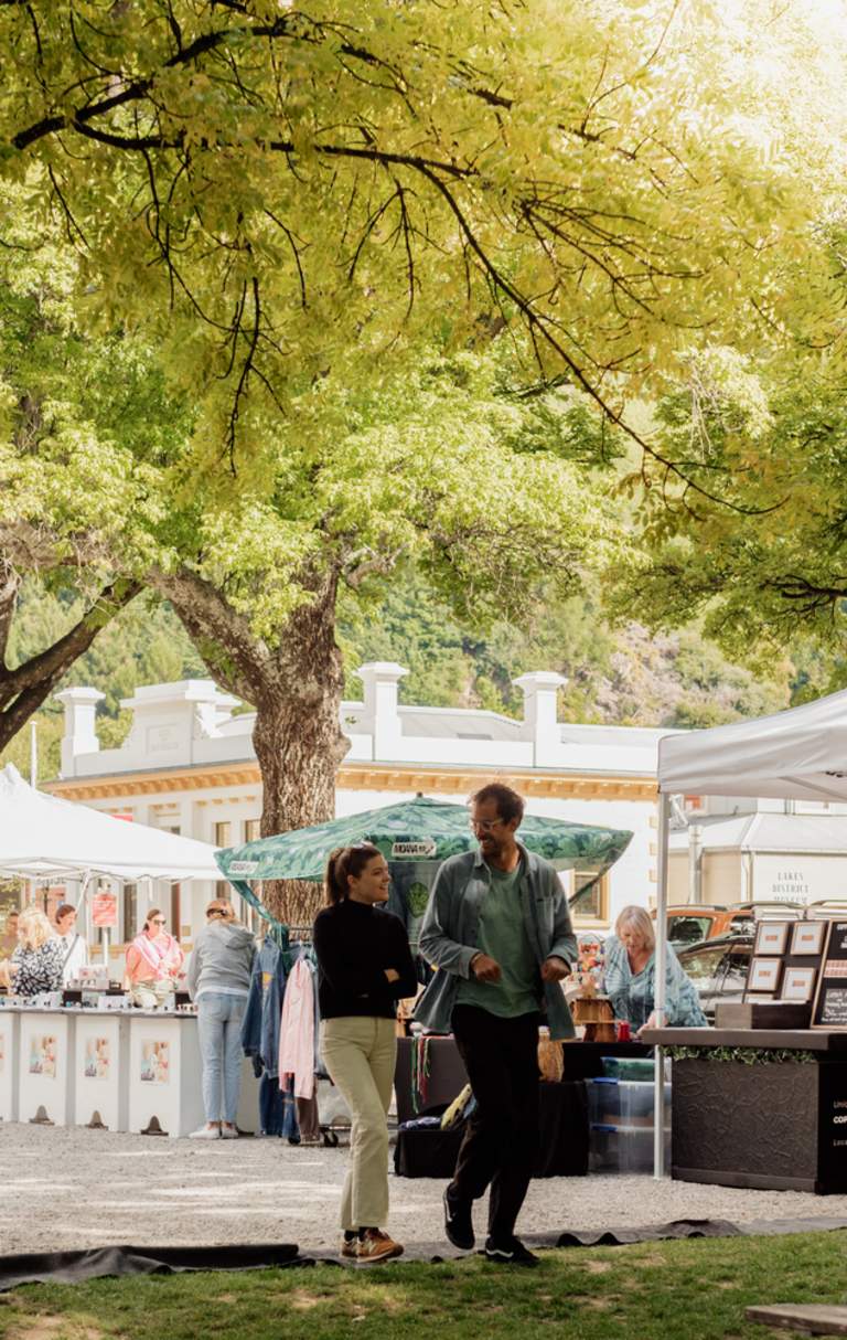 People walking through Arrowtown market
