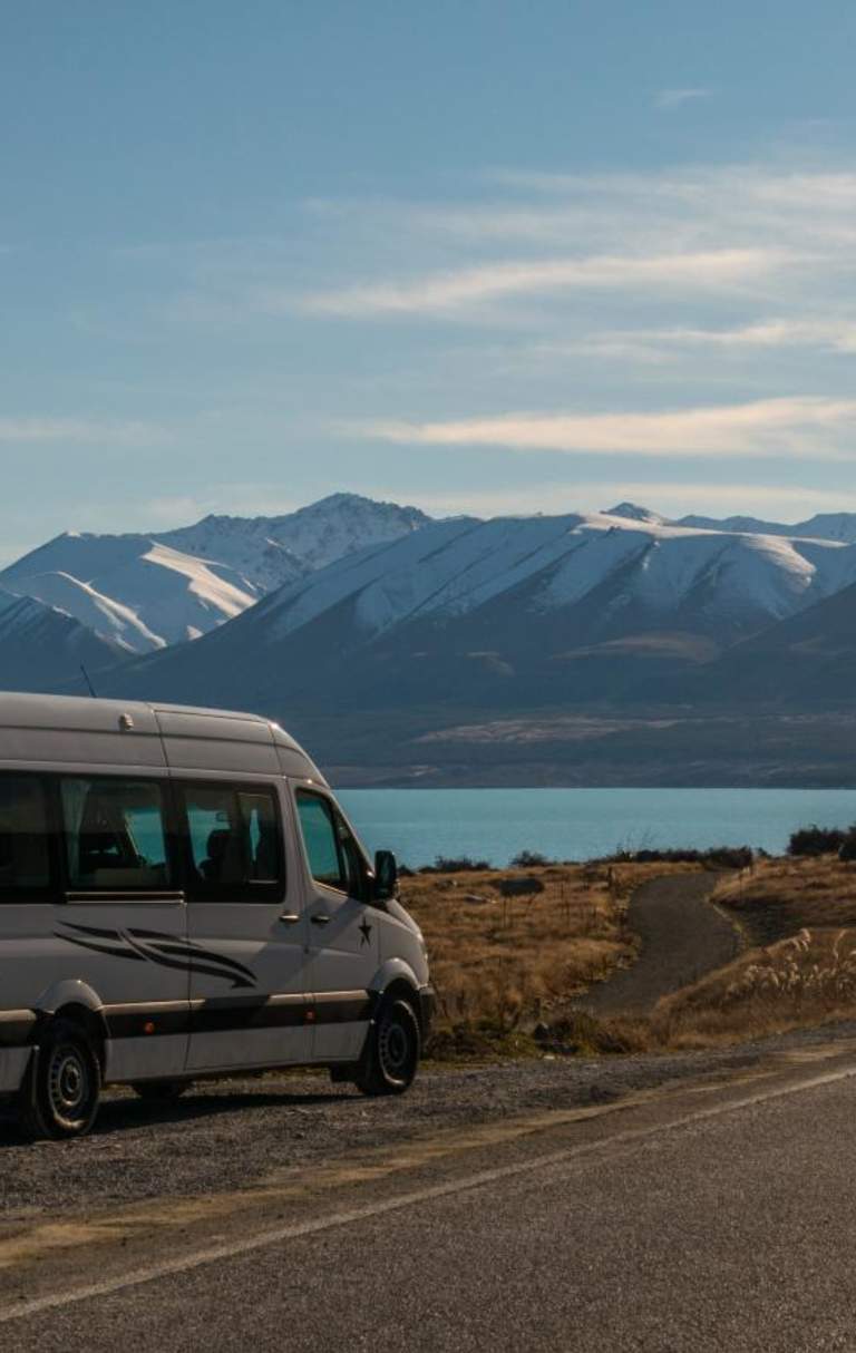 Campervan on the roadside by Lake Pukaki
