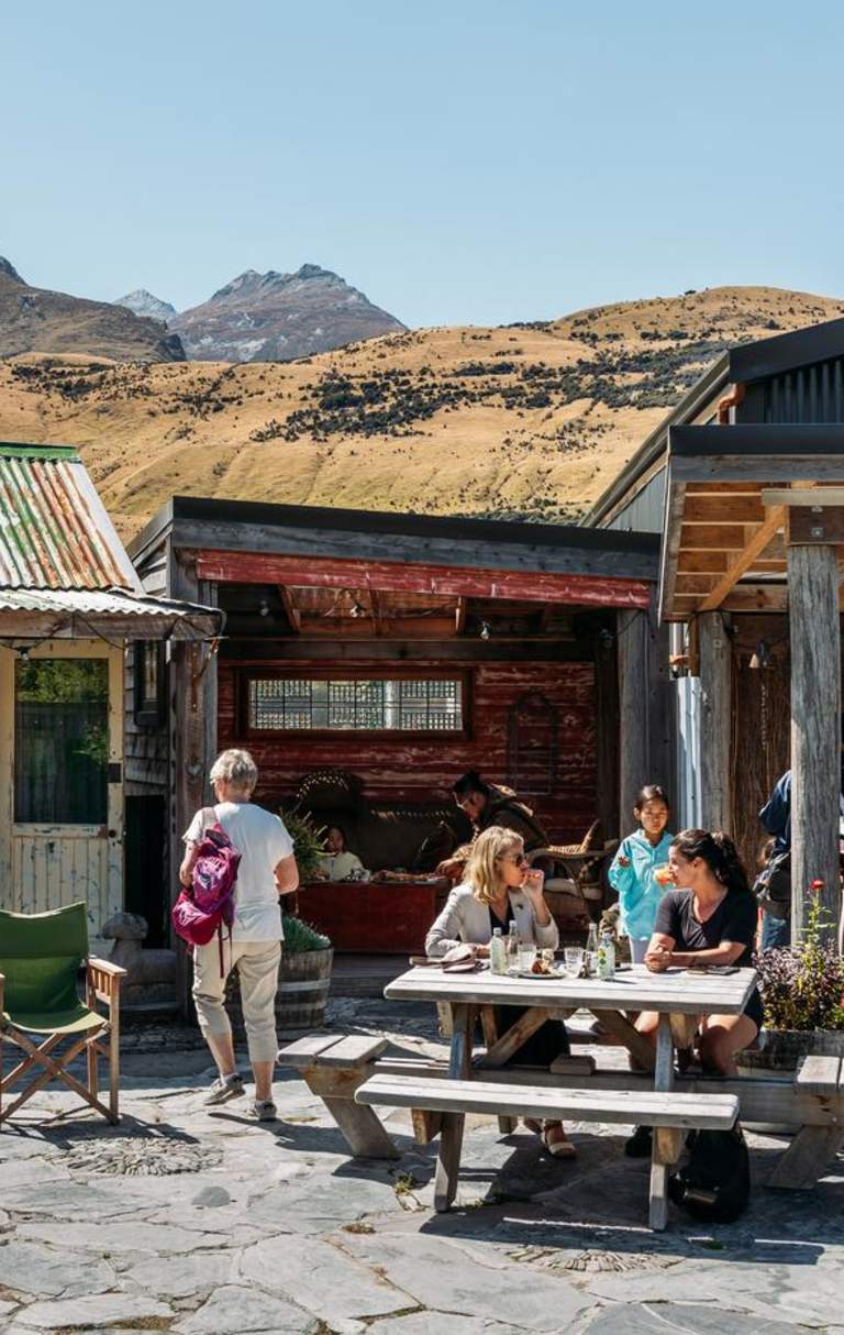 A group of people enjoying a beautiful day in Glenorchy at Mrs Wooly's General Store