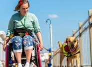 A wheelchair user and their dog on the Grand Pier at Weston-super-Mare near Bristol - credit The Grand Pier