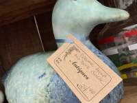 duck statue on shelf