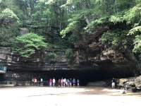people standing for a tour at the cave opening at Dunbar Cave