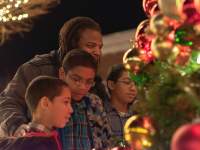 family looking at a Christmas Tree
