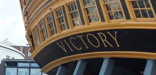 A photograph of HMS Victory showing the letter detailing close-up