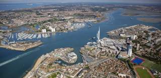 Aerial photograph looking out across Portsmouth, Gosport and Portsmouth Harbour