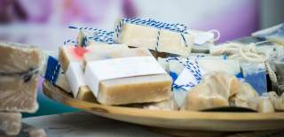 Photograph of a range of soap bars for sale at an artisan market