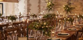 Sparkling glasses and white flower arrangements on wooden tables