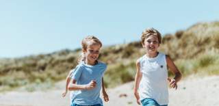Children running on Spurn beach
