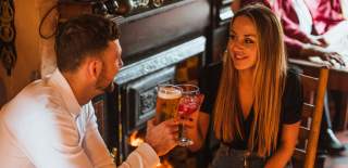 Couple drinking in the Goodmanham Arms, near Market Weighton, East Yorkshire