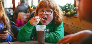 Child drinking hot chocolate - credit Mendip Activity Centre