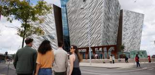 Group walking towards Titanic Belfast