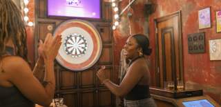 Person playing darts at Flight Club Bristol - credit Flight Club