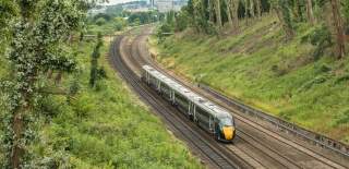 A GWR train travelling at speed on the train track - Credit Great Western Railway