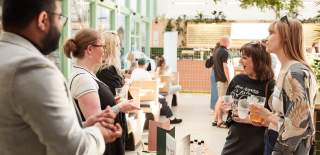 People talking at food and drink event - credit Charlotte Tolhurst