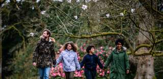 Family of four amongst the trees of Westonbirt Arboretum