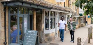 Two men walking down the street in Chipping Campden