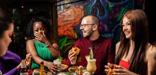 Group enjoying a festive meal at Las Iguanas