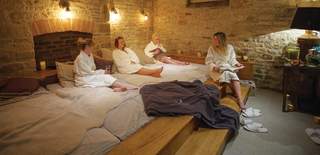 A group of ladies chatting and relaxing at The Vaulted Spa at the Kings Head Hotel in the Cotswolds