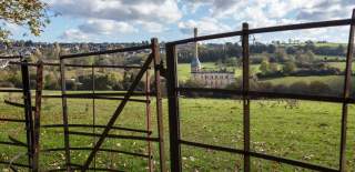 View towards Bliss Mill near Chipping Norton with a stile in the foreground