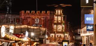 Christmas Market stalls all lit up on Southampton's Above Bar Precinct