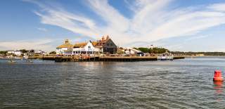 wide angle shot of Mude Quay with the ferry boarding