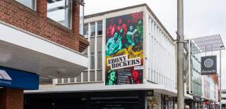 Mural of Ebony Rockers on the side of the Marlands Shopping Centre building
