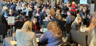 A member of the Cotswolds Tourism team talks to travel trade representatives at UK Inbound