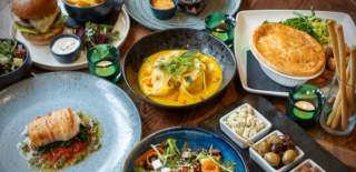 A table covered in delicious dishes at The Red Lion Long Compton in the Cotswolds