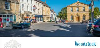 The front cover of the Woodstock digital town guide