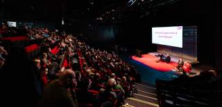 Cultural Tides conference takes place at Hull Truck theatre, an audience watches a panel on stage.