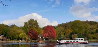 Autumn colours and boat on the Thames at Henley