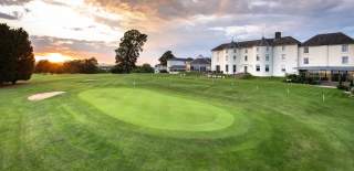 A golf green in front of Tewkesbury Park in the Cotswolds