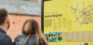 Couple looking at Market Weighton town map