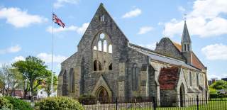 Photograph showing the Royal Garrison Church in Old Portsmouth, a church with part of the roof missing following bomb damage in The Blitz.
