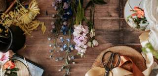Photograph of a table adorned with floral crafting items