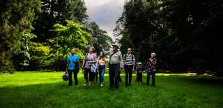 A tour group led by a guide at Westonbirt Arboretum