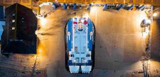 An aerial photograph showing a hovercraft at the Hovertravel terminal at night