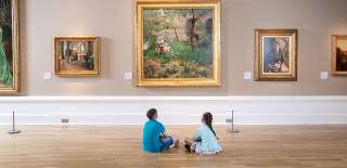 Two children at Ulster Museum looking at artwork