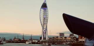 Photograph of the Spinnaker Tower with a viewfinder binoculars in the foreground