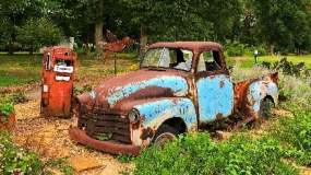 Old truck and gas pump in the garden at UT Botanical Gardens