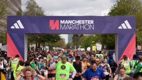 Runners at the finish line of the Manchester Marathon