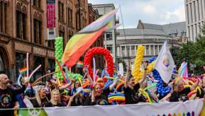 People celebrating Manchester Pride during the parade