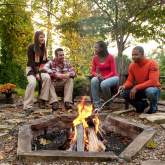 People Sitting Around Fire Pit