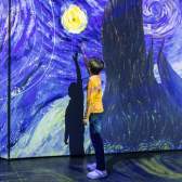 A child reaching up to the stars in Van Gogh's "Stary Night".