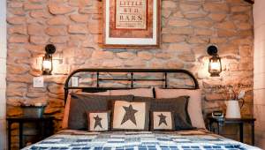 An inviting bed in a guest room at the Red Barn Guest House in St. Charles, MO.