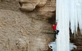 Aaron Mulkey climbing a frozen waterfall