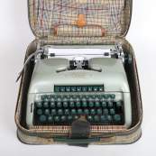 Light colored Oliver Typewriter in plaid case